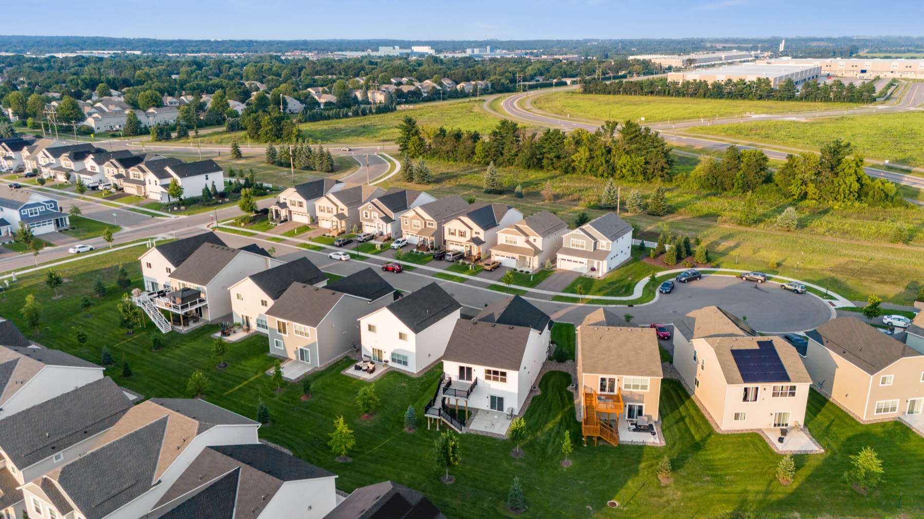 Aerial view of a neighborhood beside open green space