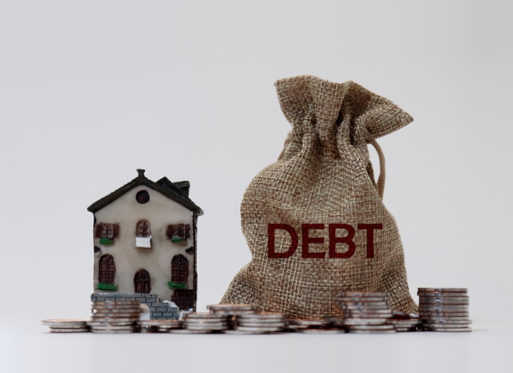 Title card for the article: Can I Buy a House If I Have Collections or Debt? (Minnesota Guide – 2026)