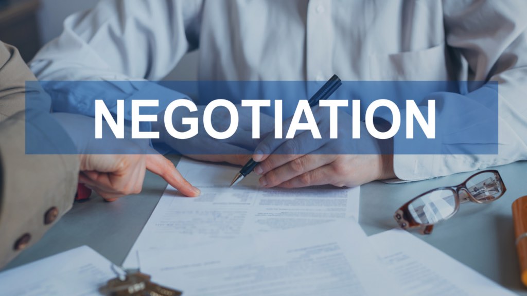 Minnesota home seller reviewing pricing strategy with their Realtor to understand whether pricing above market value leaves room for negotiation in the Twin Cities