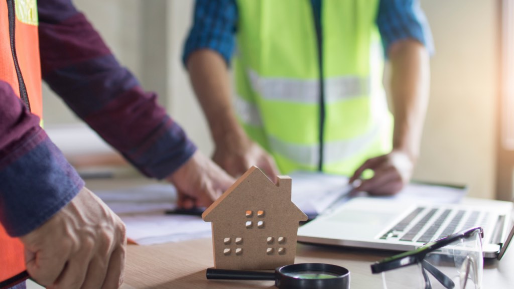 Minnesota homebuyer and home inspector evaluating a property together during a pre-offer inspection in the Twin Cities competitive market