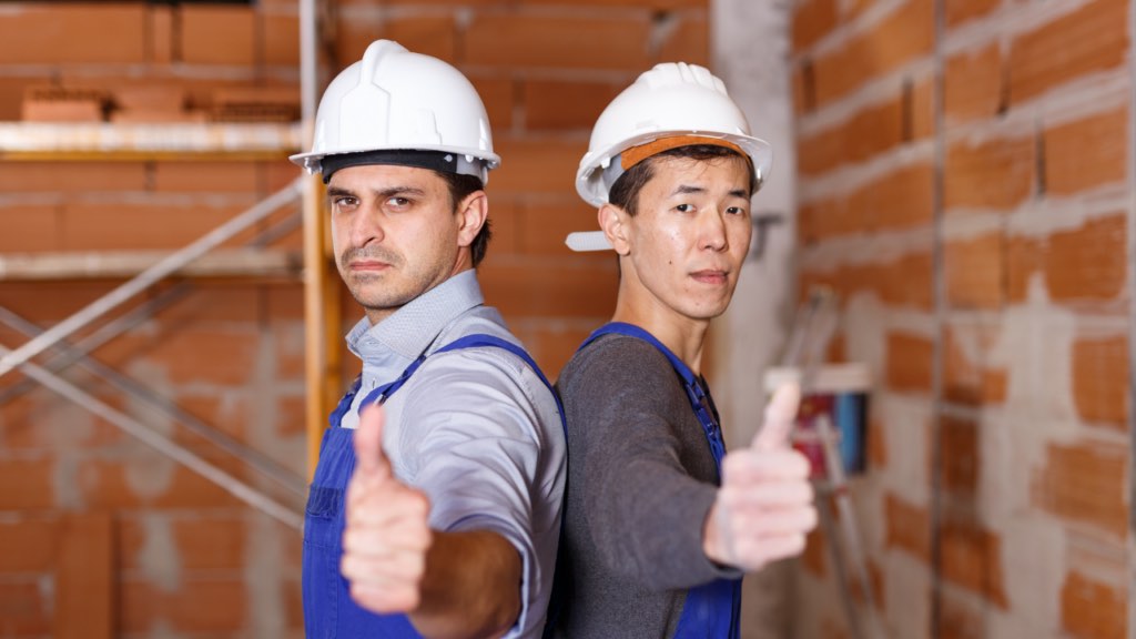 New Minnesota homeowner reviewing builder warranty documents and home maintenance information after closing