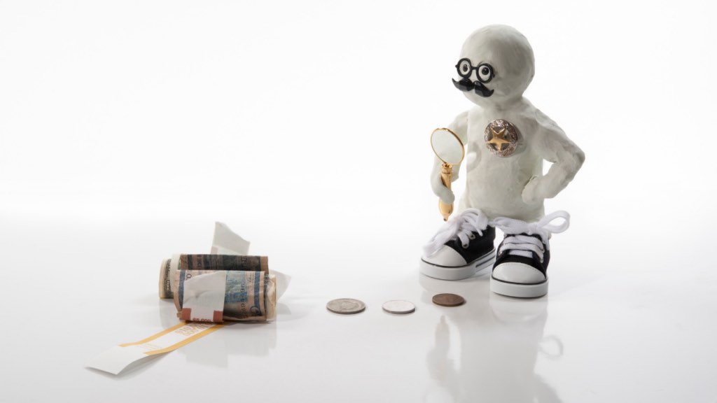 Minnesota immigrant homebuyer reviewing compliance documentation package with title company closing officer to ensure smooth anti-money laundering verification at real estate closing in the Twin Cities