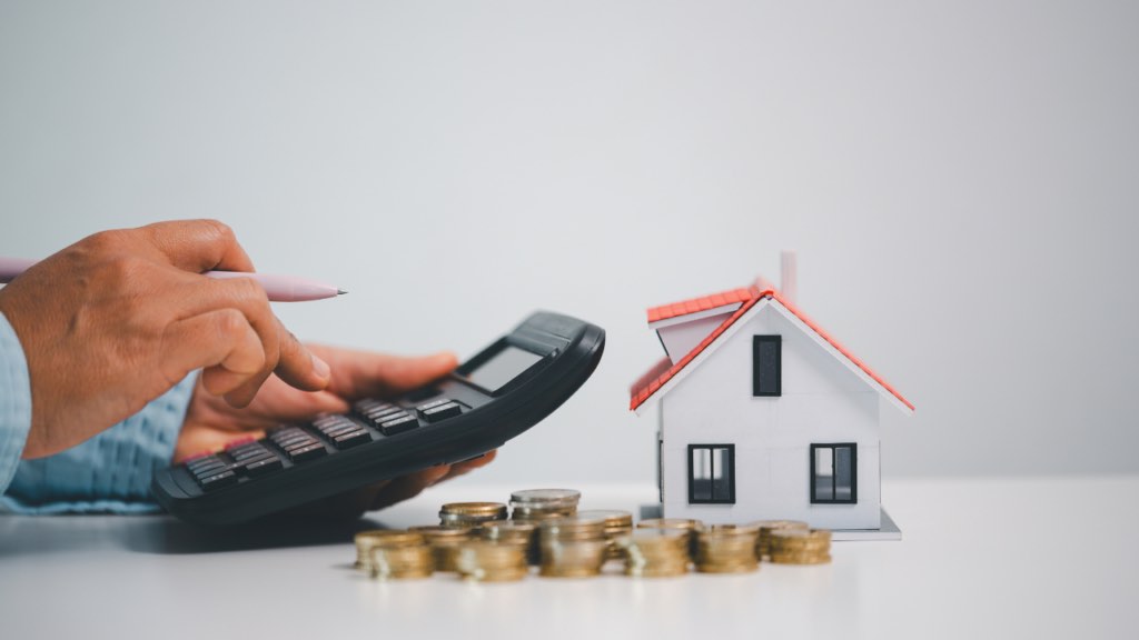 Immigrant homebuyer comparing mortgage lenders and financing options in Minnesota