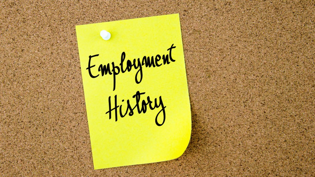 Immigrant professional in Minnesota organizing overseas employment documentation including experience letters tax records and employment contracts to support mortgage qualification in the Twin Cities