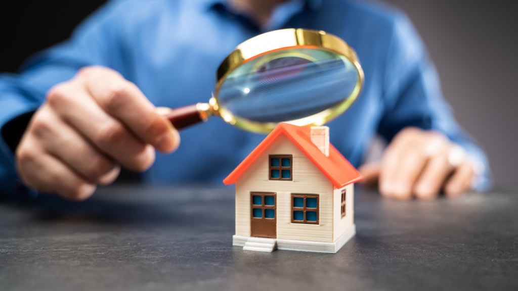 Professional home inspector evaluating a newly built Minnesota home before closing