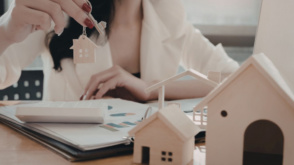 Homebuyer organizing bank statements and transfer records needed for mortgage approval in Minnesota