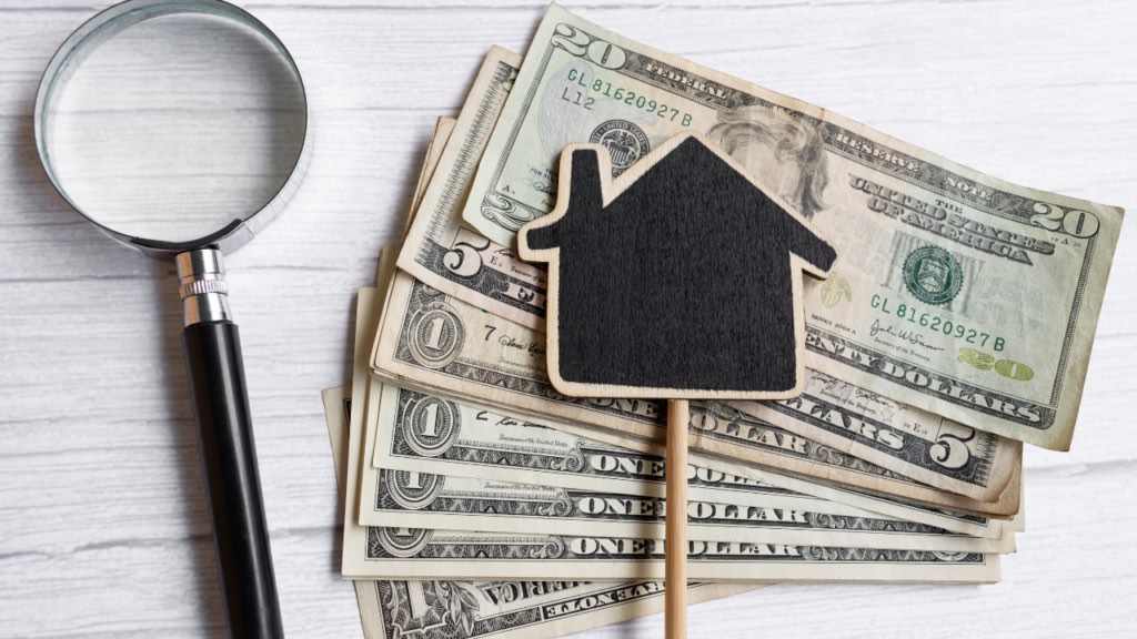 Minnesota homeowner reviewing a home budget with repair, utility, and maintenance expenses