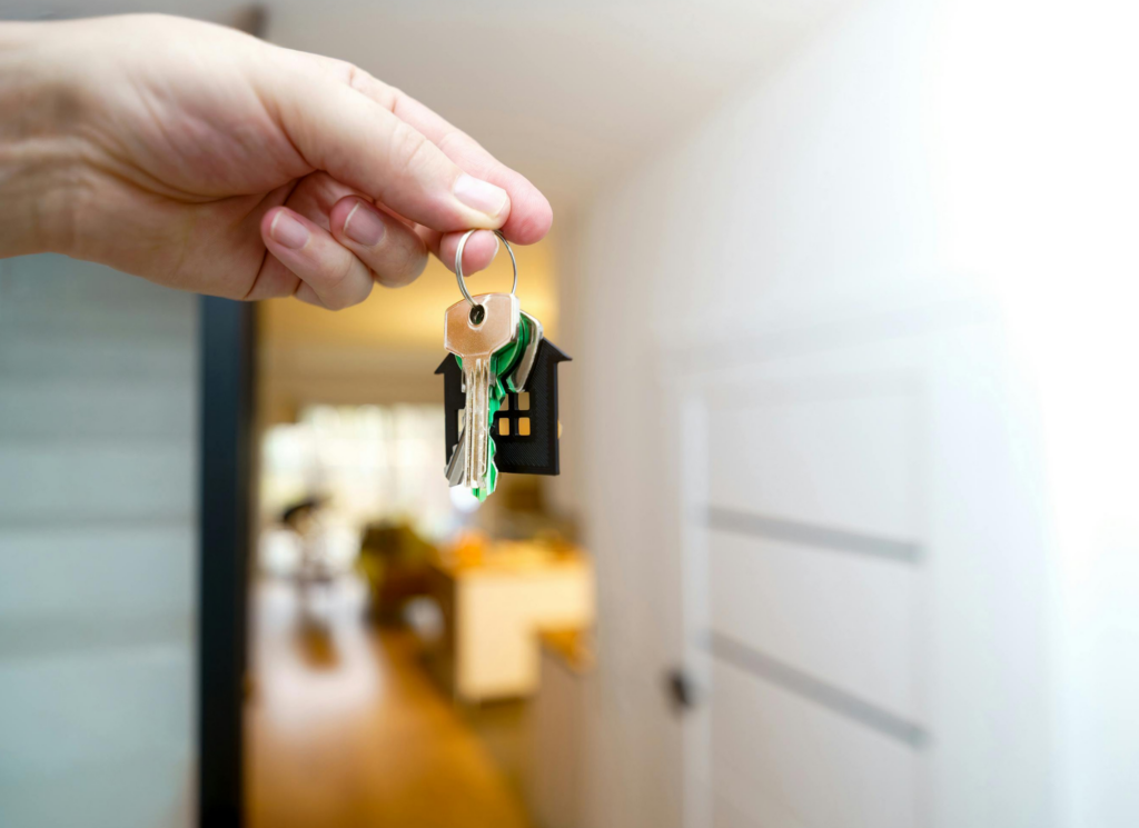 Minnesota homeowner signing home sale documents with real estate agent