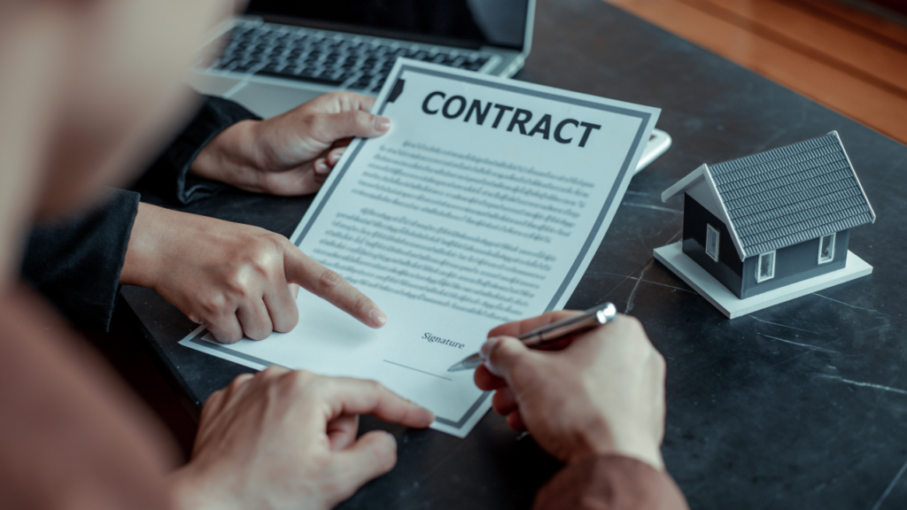 Immigrant freelancer reviewing mortgage paperwork and business income documents in Minnesota