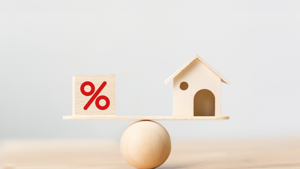 Home seller discussing interest rates and pricing strategy with real estate agent