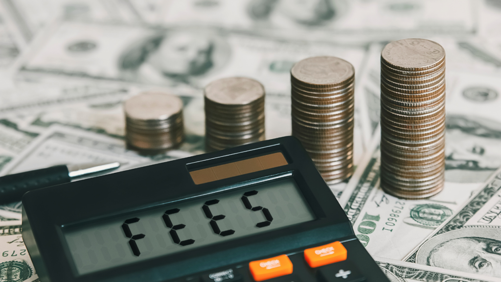 Minnesota homebuyer reviewing lender fees and closing cost documents with mortgage professional