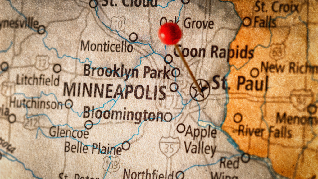 Homebuyers comparing Minneapolis and St. Paul neighborhoods before moving to Minnesota