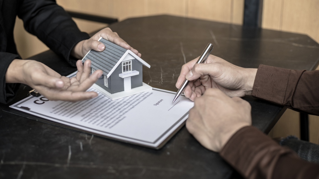 Buyer reviewing a real estate purchase agreement with agent