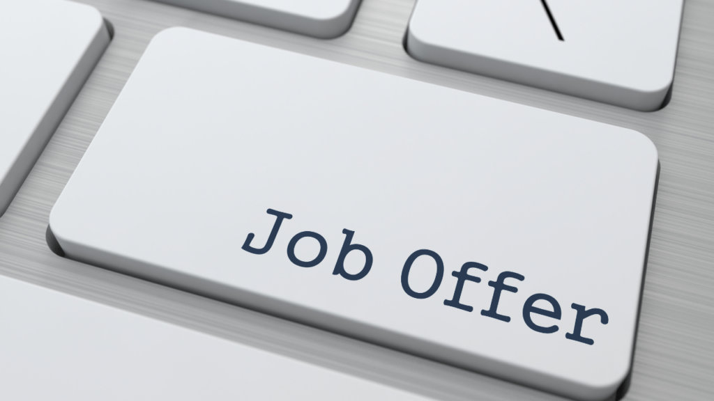 Immigrant professional reviewing job offer and mortgage paperwork in Minnesota