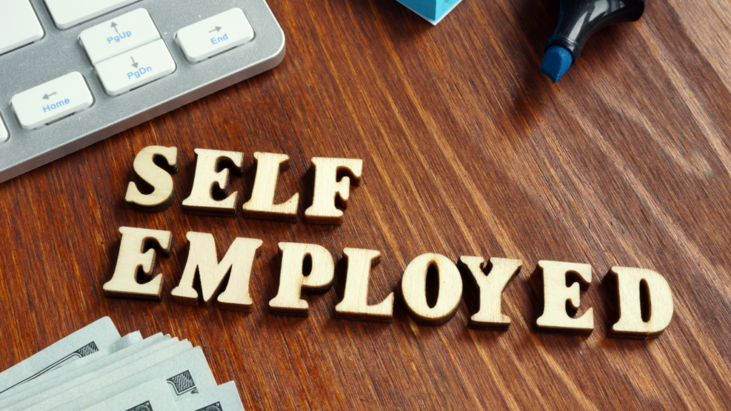 Self-employed Minnesota homebuyer reviewing business income records and mortgage documents