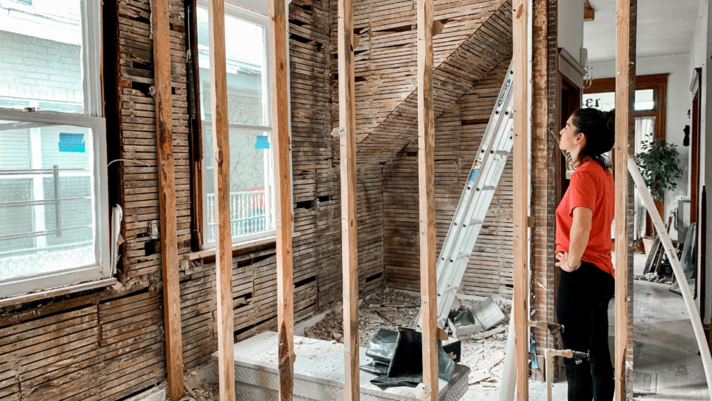 Minnesota homeowner reviewing a home repair budget while planning future maintenance expenses