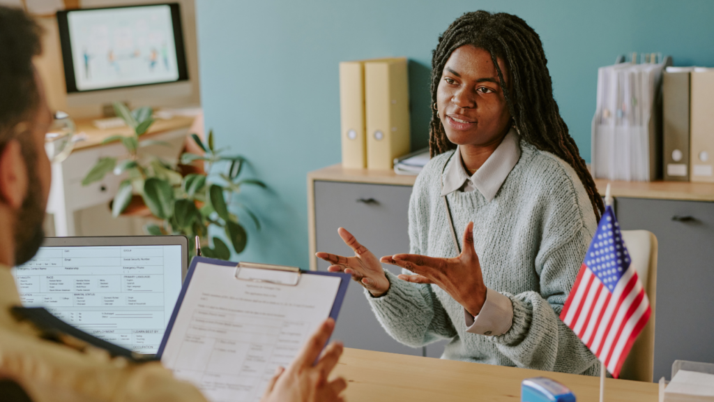 Immigrant family reviewing monthly homeowner expenses and household budget after buying a home in Minnesota
