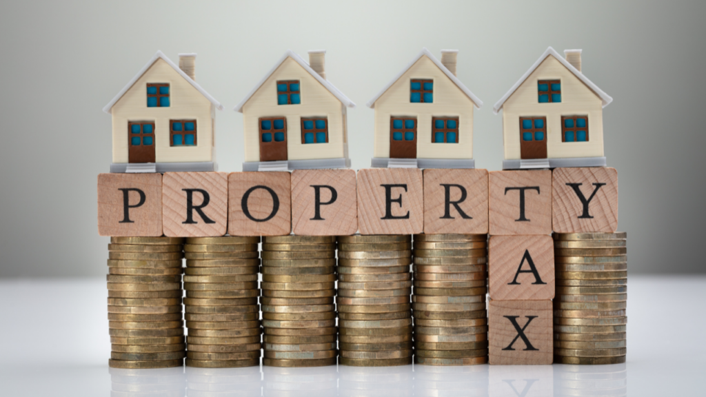 Minnesota homeowner reviewing property tax documents and monthly housing expenses