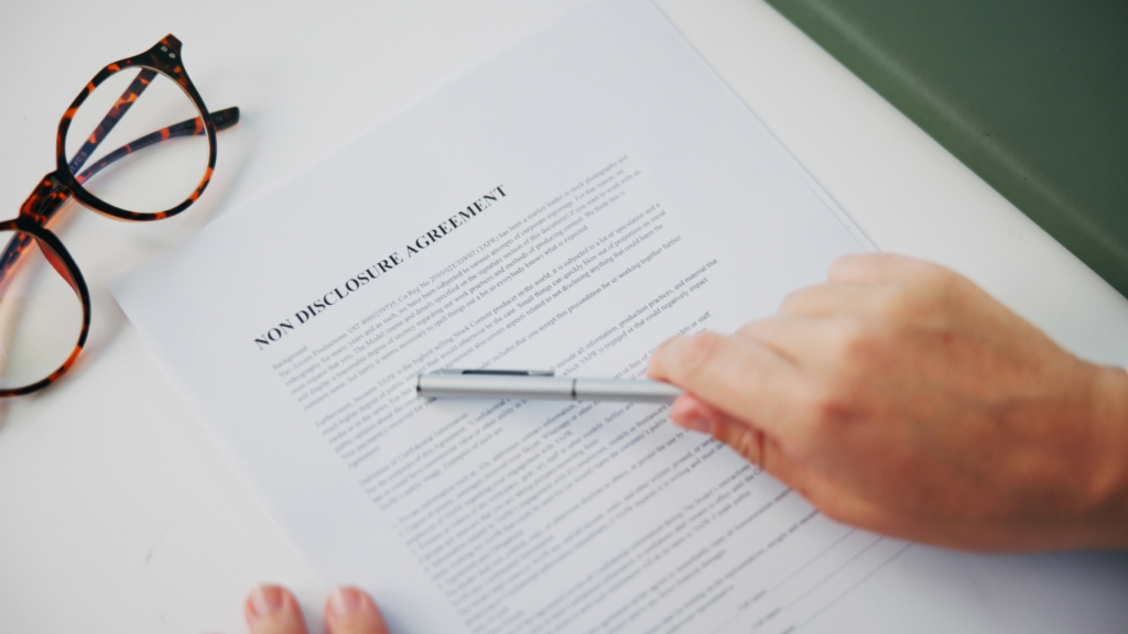 First-time immigrant homebuyer reviewing seller disclosure documents with a Minnesota real estate agent