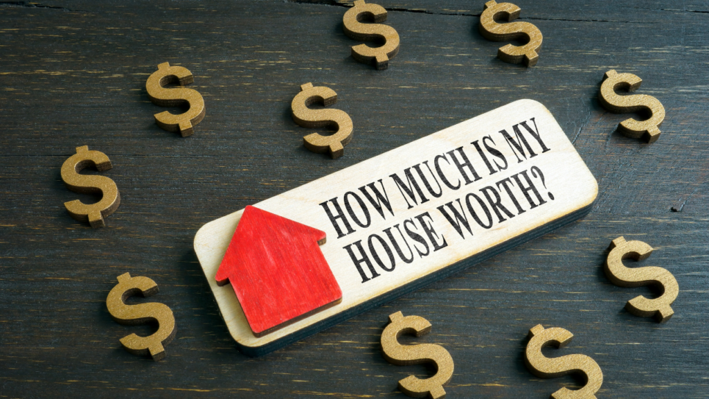 Minnesota homeowner sitting with a Realtor reviewing mortgage payoff and home value numbers to understand options for an underwater mortgage