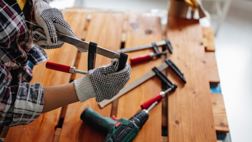 Minnesota homeowner reviewing major repair estimates with a Realtor while deciding whether to fix issues before selling