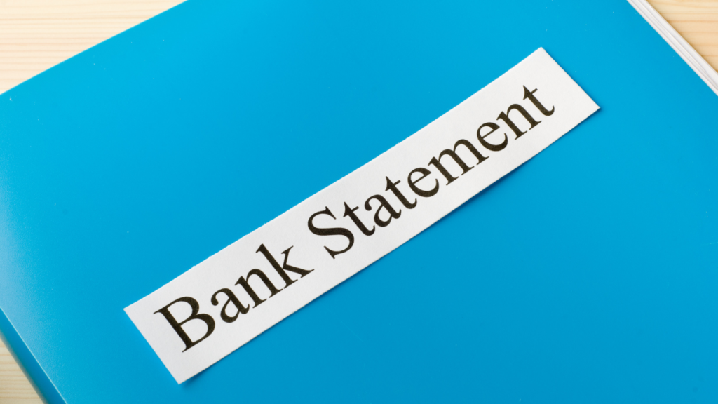 Immigrant homebuyer in Minnesota organizing foreign bank statements and wire transfer documentation to present to a mortgage lender for home loan qualification in the Twin Cities