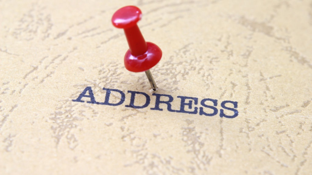 Minnesota homeowner updating address records on a laptop after closing on a new home representing the comprehensive address change process for new homeowners