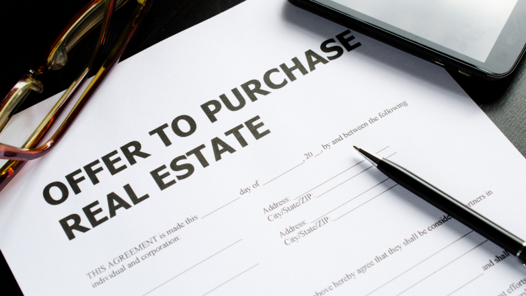 Minnesota home seller reviewing a comparative market analysis with their Realtor to develop a pricing strategy that attracts multiple offers in the Twin Cities