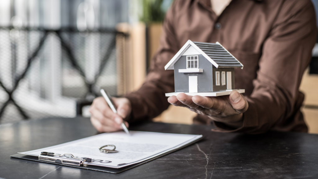 Immigrant gig worker in Minnesota organizing tax returns and bank statements to qualify for a mortgage home loan in the Twin Cities with self-employment income