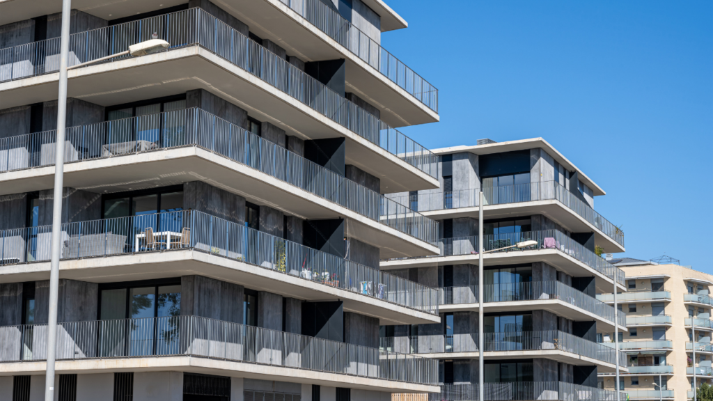 Three different Minnesota property types side by side representing a condo building, a townhome community, and a single-family home for homebuyer comparison