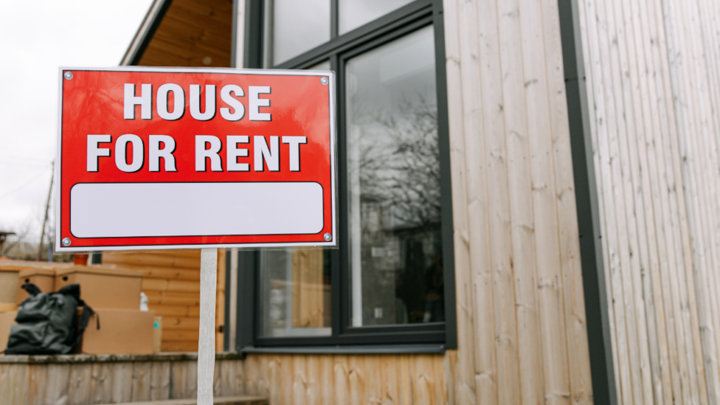 Minnesota homeowner reviewing rental income analysis and property management options before converting their home to a rental property in the Twin Cities