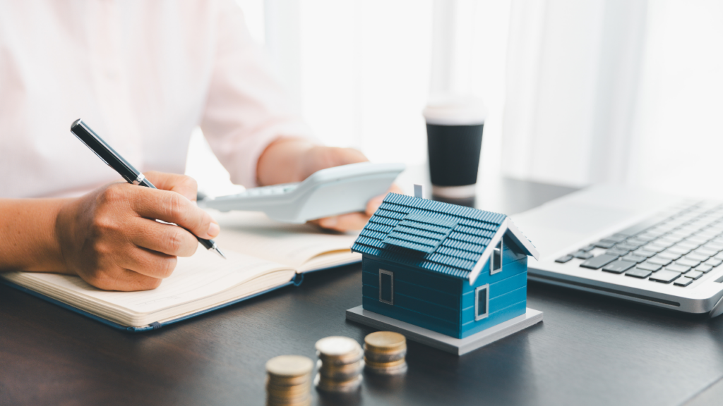 Minnesota homebuyer reviewing a detailed loan estimate document with their Realtor to understand every lender fee and closing cost category before closing on a Twin Cities home purchase
