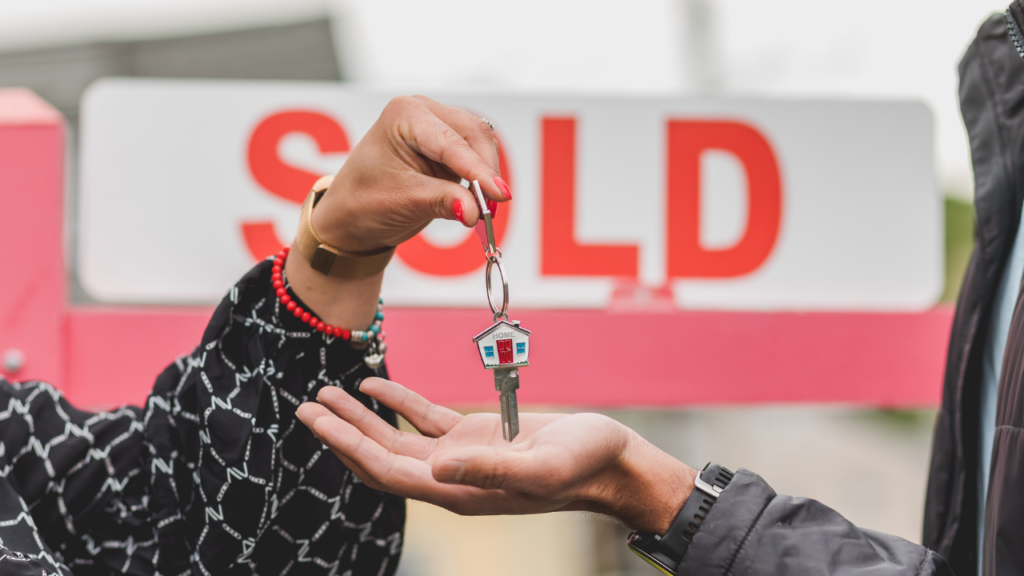 Minnesota home seller signing closing documents at a title company on closing day in the Twin Cities