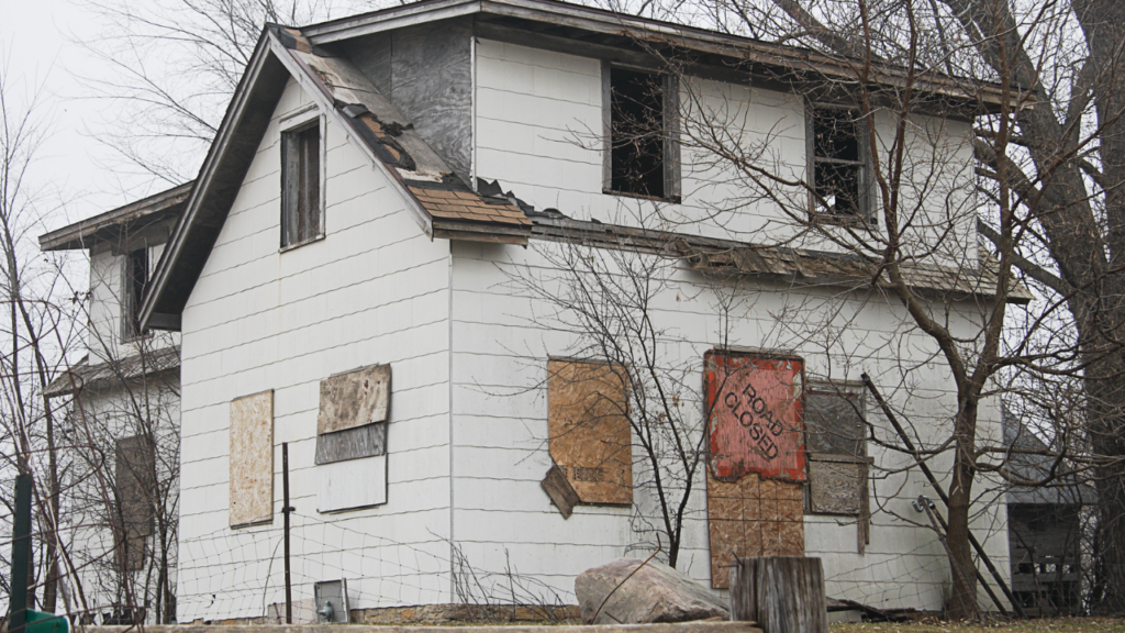 Minnesota fixer-upper home exterior with visible renovation potential representing the due diligence and financial planning required before purchasing a home that needs significant work