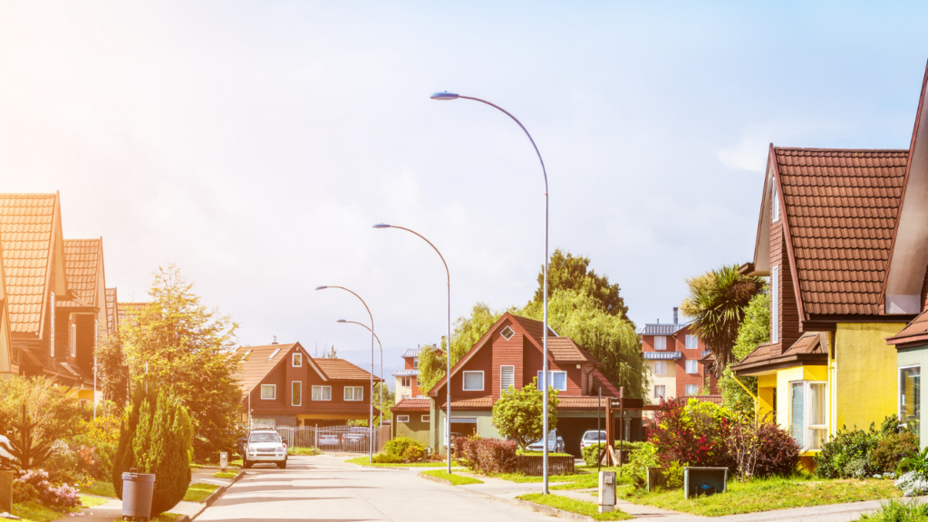 Minnesota homebuyer walking through a suburban neighborhood evaluating the community feel and lifestyle fit before making a home purchase decision in the Twin Cities