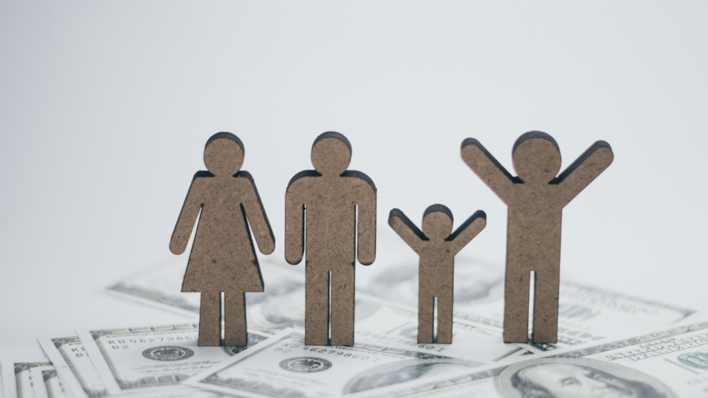 Minnesota homebuyer organizing income documents including pay stubs and tax returns with a lender to complete mortgage qualification in the Twin Cities