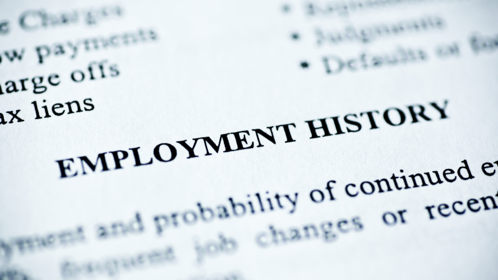 Minnesota homebuyer reviewing employment history documents with a mortgage lender to evaluate job history for home loan qualification in the Twin Cities