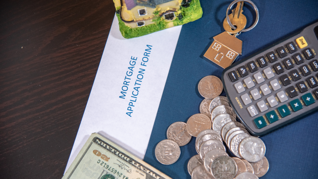 Minnesota homebuyer reviewing debt-to-income ratio calculation with a mortgage lender to determine home purchase qualification in the Twin Cities