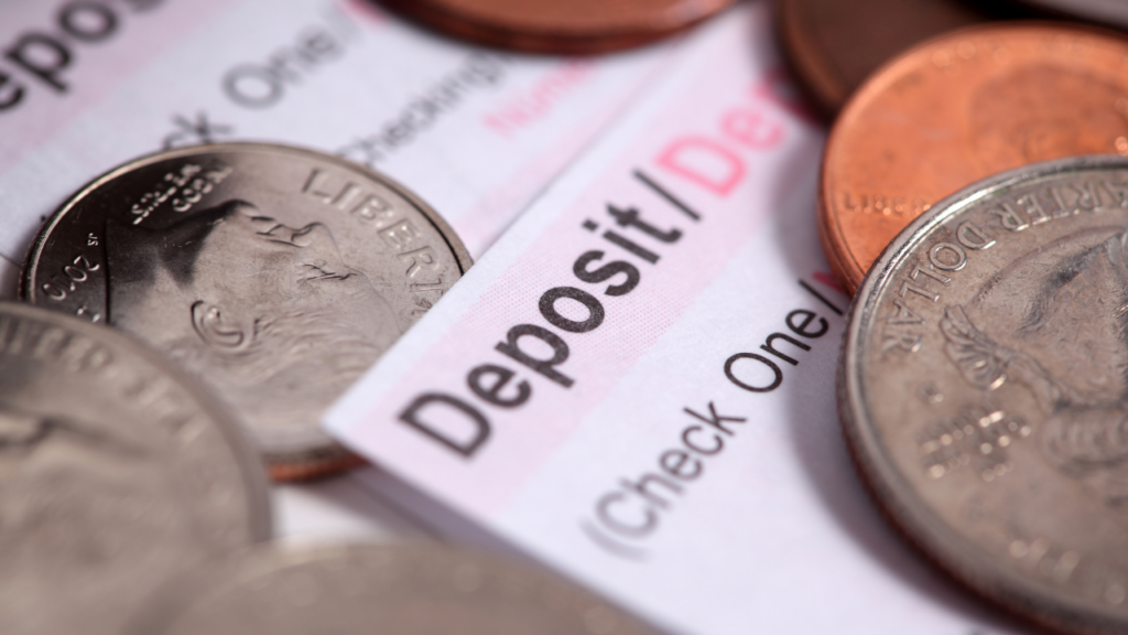 Minnesota immigrant homebuyer organizing international wire transfer documentation and bank statements to satisfy mortgage lender requirements for large foreign deposits in the Twin Cities