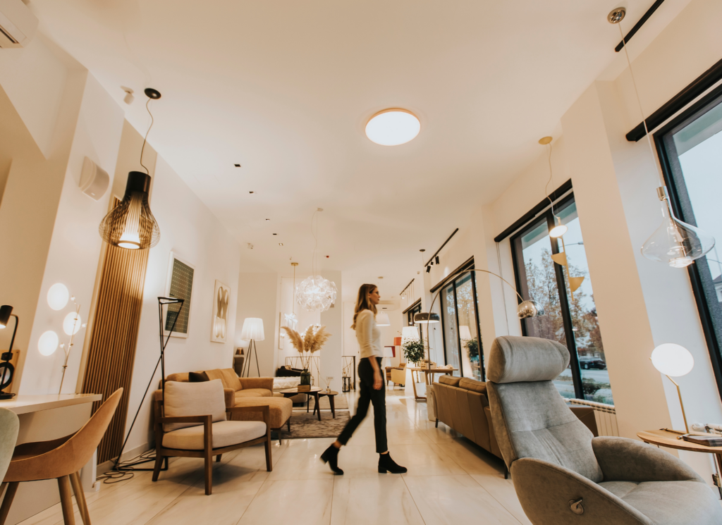 A homebuyer and real estate agent walking through an empty Minnesota home checking rooms before closing day.