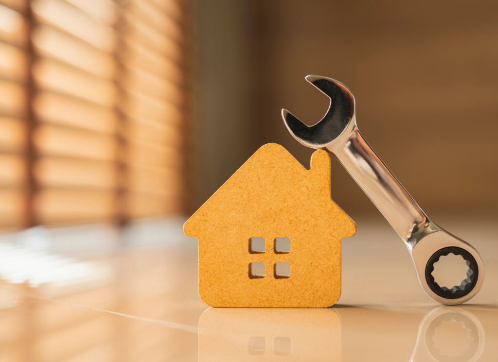 A homeowner inspecting a home's exterior and systems in preparation for listing it for sale.