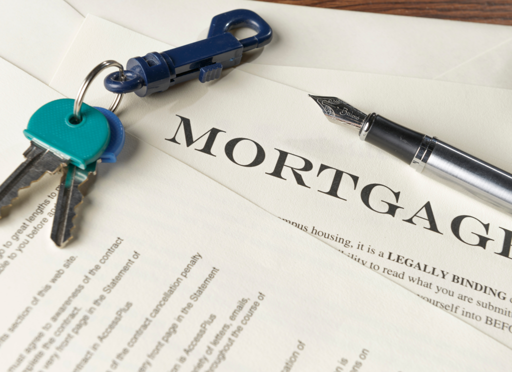 A person reviewing a signed job offer letter next to a laptop, representing how a new job offer can support a Minnesota mortgage application.