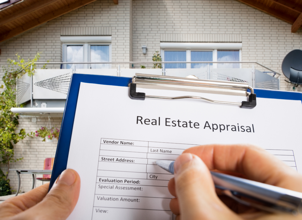 An appraiser measuring and inspecting the exterior of a Minnesota home before a mortgage closing.
