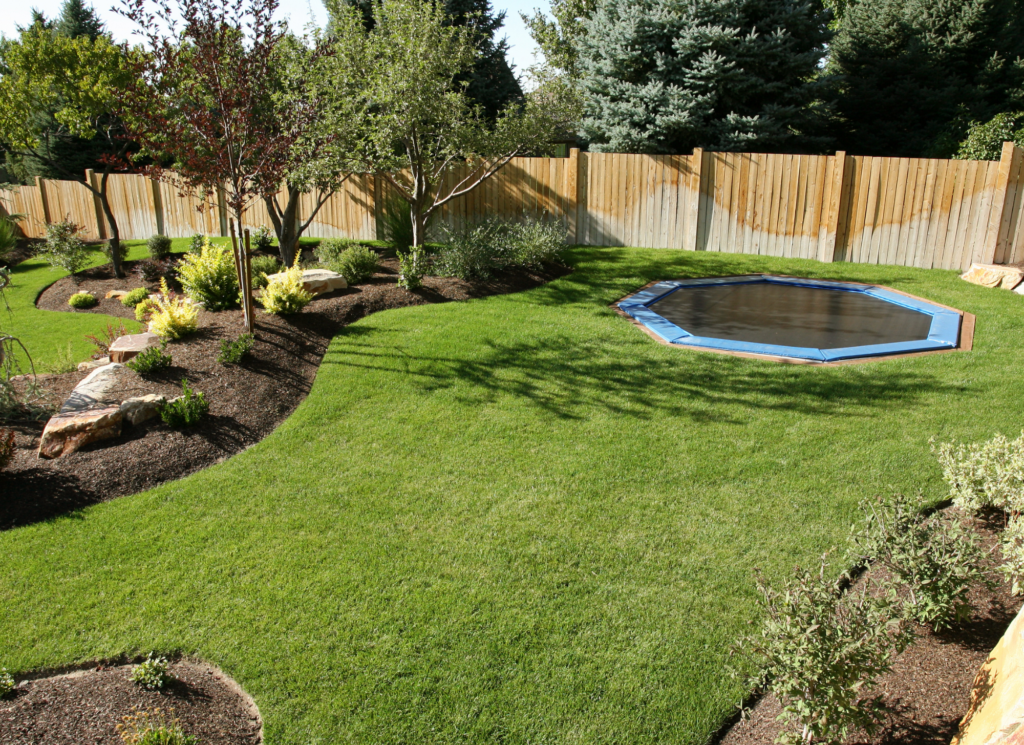 A well maintained front yard with trimmed landscaping and a tidy walkway outside a Minnesota home for sale.